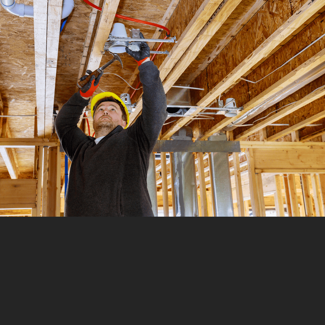 Electrician Installing Can Light